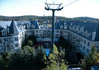 View of the Marriott Hotel from the free open gondola-type lift called The Cabriolet, which connects the upper and lower parts of the pedestrian village. From the top of this lift the main gondola is available to take skiers to the summit of the mountain. September 2007